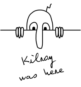 A black line drawing shows a long-nosed figure peeking over a wall above the words “Kilroy was here.”